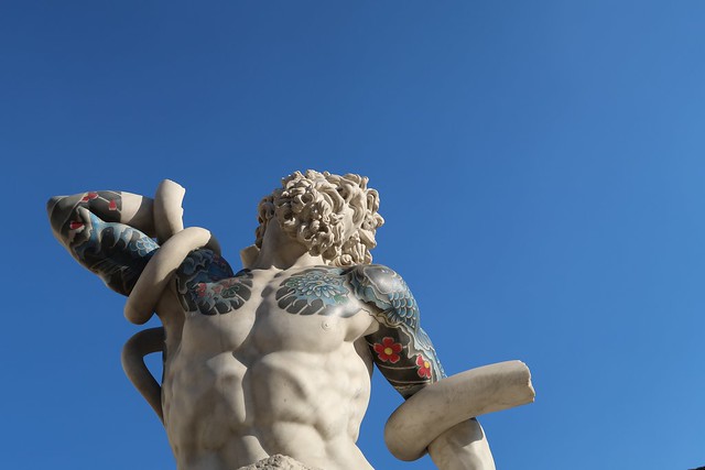 statue with tattoo